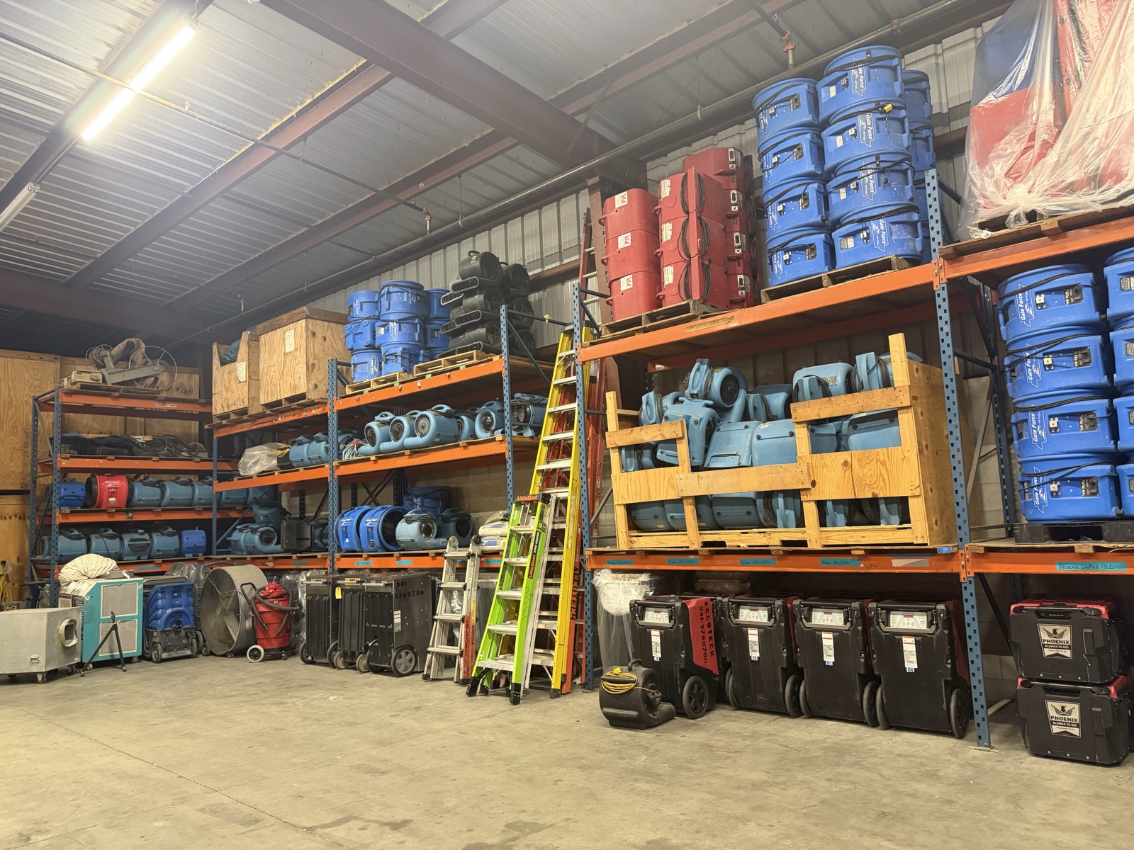 Accutech's full restoration equipment warehouse in Sarasota — air movers, dehumidifiers, and HEPA scrubbers in stock
